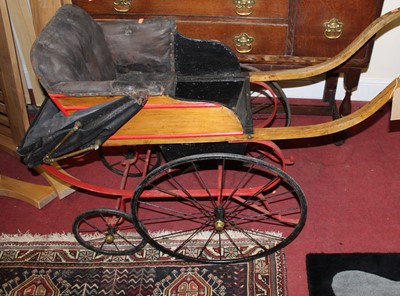 Lot 1466 - A late Victorian pram, having part-painted ash...