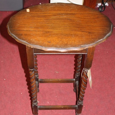 Lot 1406 - A 1920s shaped top barley twist oak occasional...