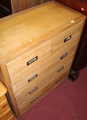 Lot 1420 - A contemporary light oak chest of two short...