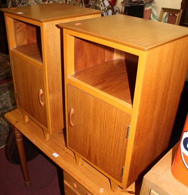 Lot 1422 - A pair of 1960s walnut single door bedside...