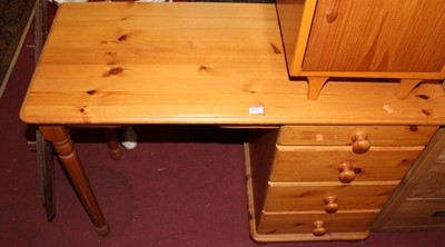 Lot 1423 - A modern pine round cornered single pedestal...