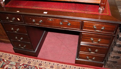 Lot 1428 - A reproduction mahogany and gilt tooled...