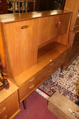 Lot 1455 - A 1970s G-plan teak side cabinet, having twin...