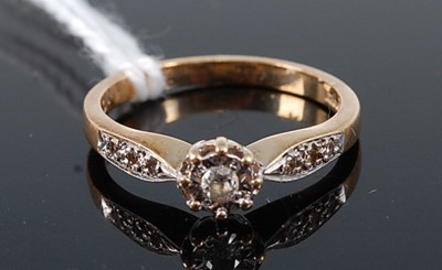 Lot 383 - A 9ct gold diamond solitaire ring, the...