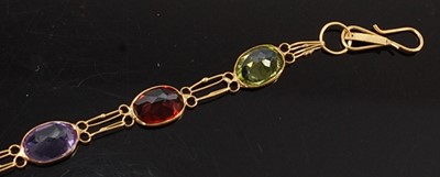 Lot 2598 - A yellow metal multi-stone bracelet,...