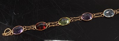Lot 2598 - A yellow metal multi-stone bracelet,...