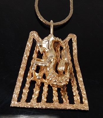 Lot 2624 - A yellow metal three-dimensional pendant in...