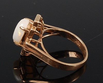Lot 2625 - A yellow metal opal dress ring, featuring an...