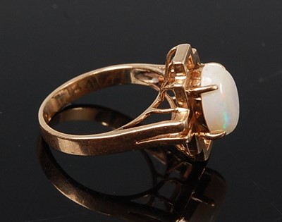 Lot 2625 - A yellow metal opal dress ring, featuring an...