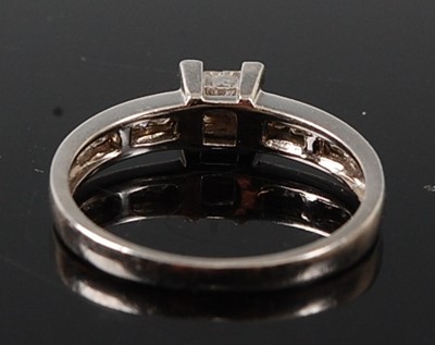 Lot 2596 - A platinum diamond quatrefoil cluster ring,...
