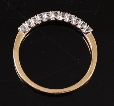 Lot 2607 - A 9ct yellow and white gold diamond half hoop...