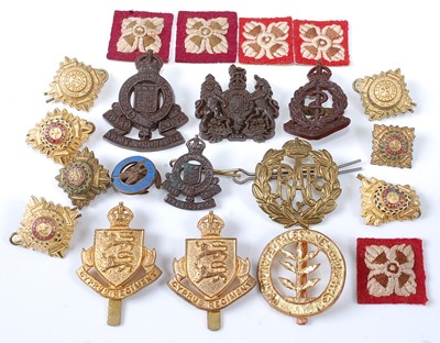Lot 2223 - A collection of cap badges and insignia to...