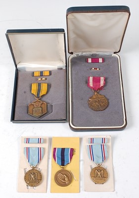 Lot 2405 - A collection of five American medals to...