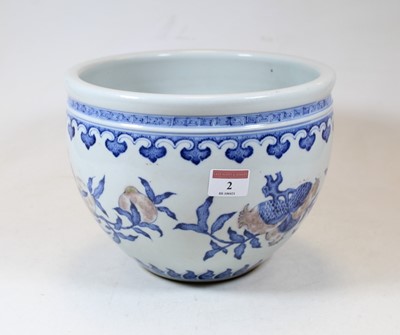 Lot 72 - A Chinese stoneware blue and white jardinière,...