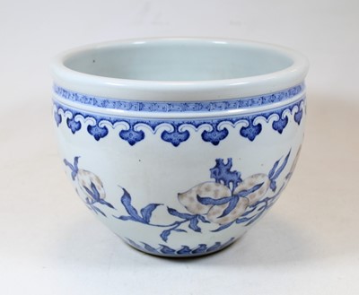 Lot 2 - A Chinese stoneware blue and white jardinière,...