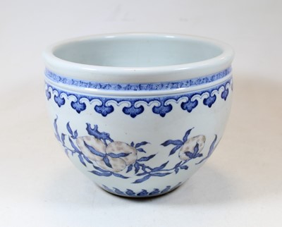 Lot 2 - A Chinese stoneware blue and white jardinière,...