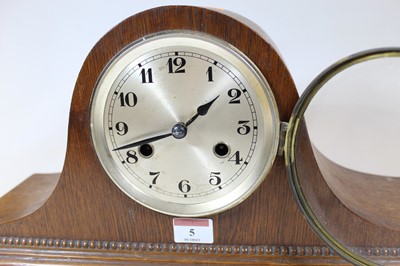 Lot 5 - A 1930s oak cased mantel clock, having a...