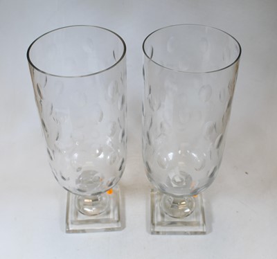 Lot 17 - A pair of modern cut clear glass storm lamps,...