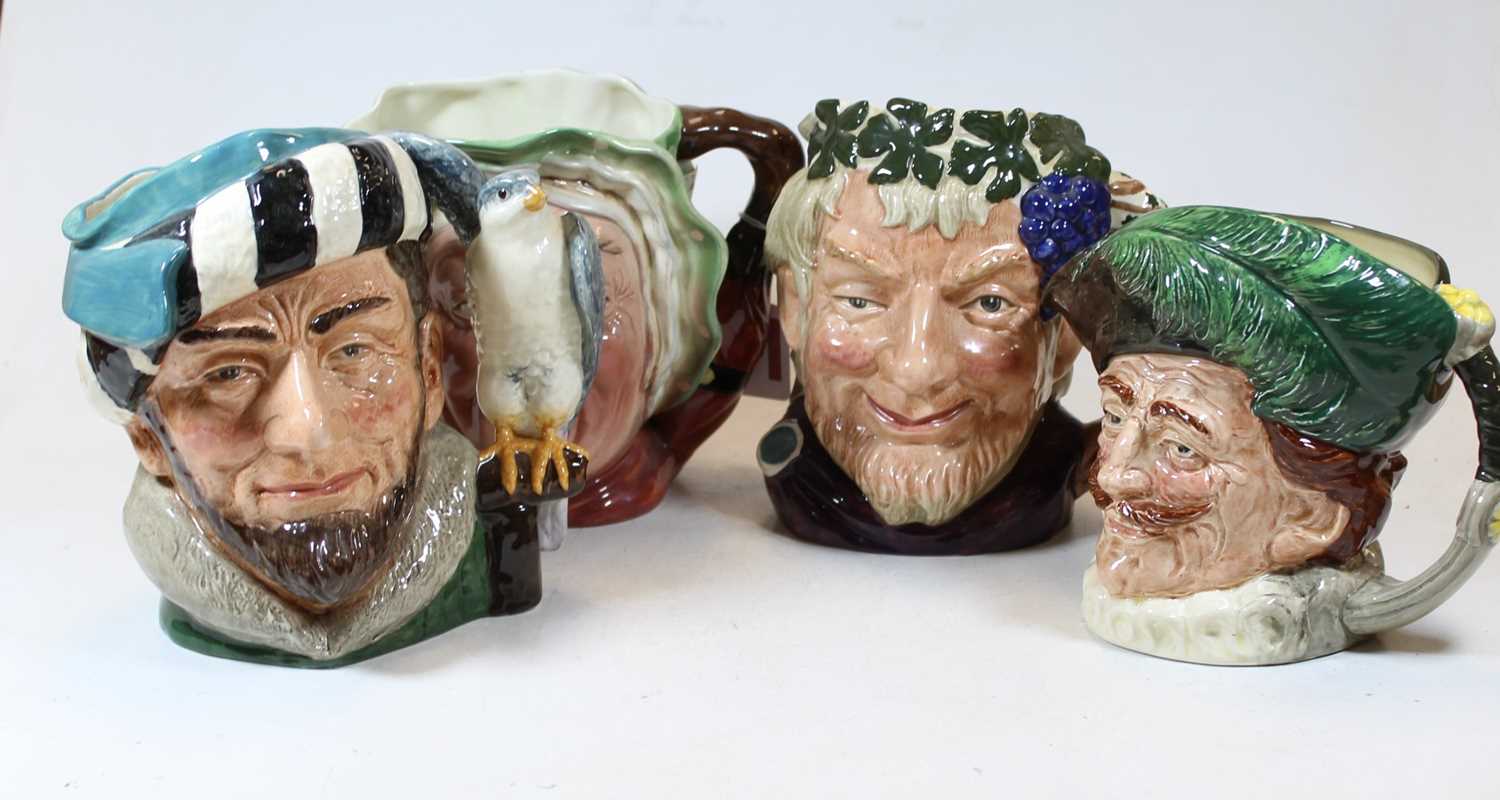 Lot 39 - A collection of three Doulton character jugs,...