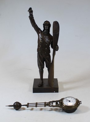 Lot 40 - A modern bronzed mystery clock in the form of...