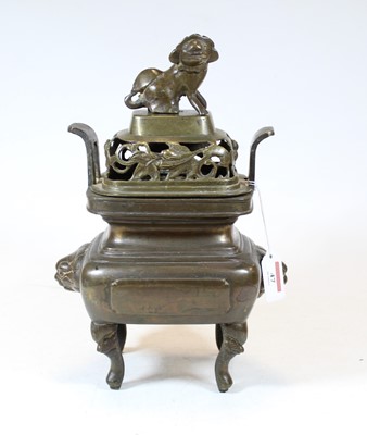 Lot 47 - A Chinese bronze koro, the pierced cover...