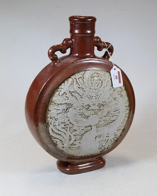 Lot 48 - A Chinese stoneware moon flask, the red lustre...