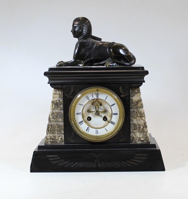 Lot 50 - A late Victorian black slate mantel clock,...