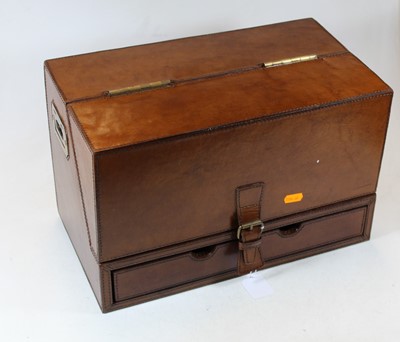 Lot 64 - A modern tan leather clad stationery cabinet,...