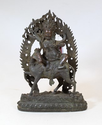 Lot 109 - A bronzed metal figure of a deity on horseback,...