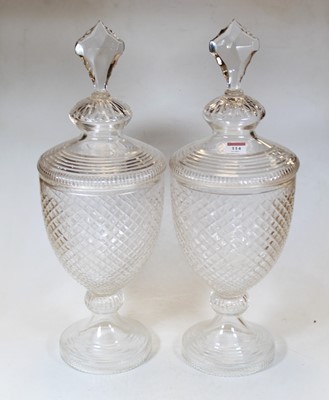 Lot 114 - A pair of large clear cut glass jars and...