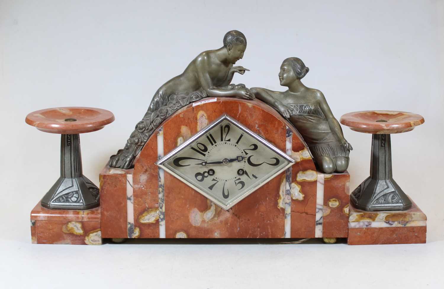 Lot 139 - An Art Deco rouge and veined marble clock...