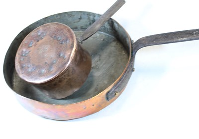Lot 141 - A large late 19th century brass frying pan...