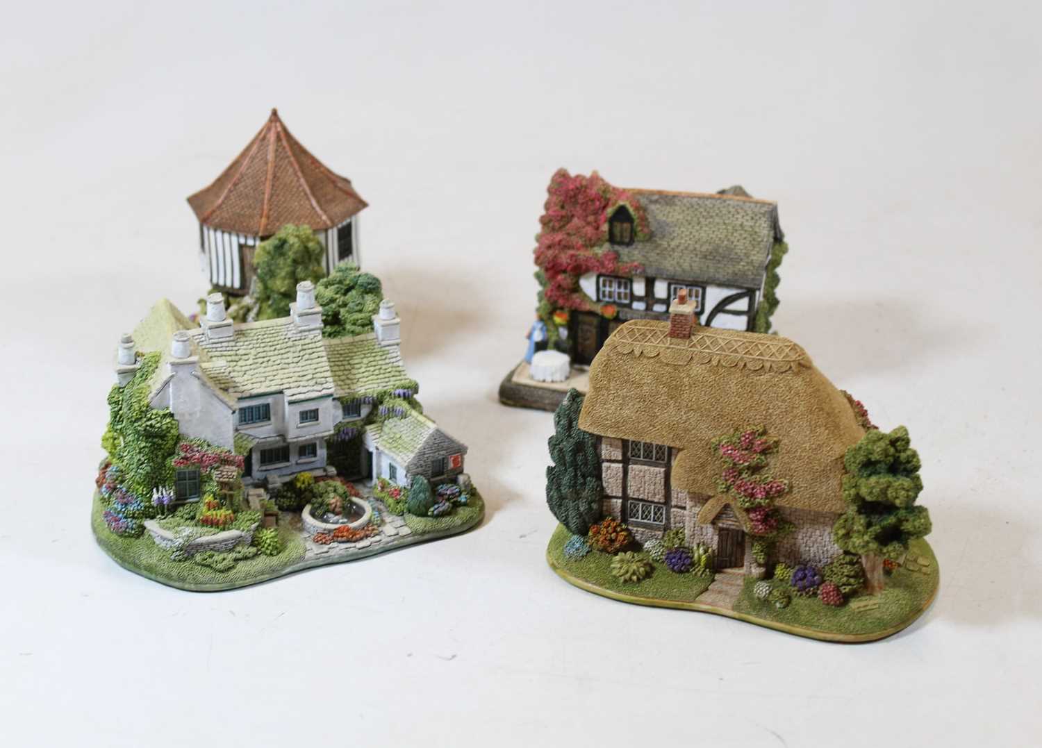 Lot 215 - A collection of four boxed Lilliput Lane...
