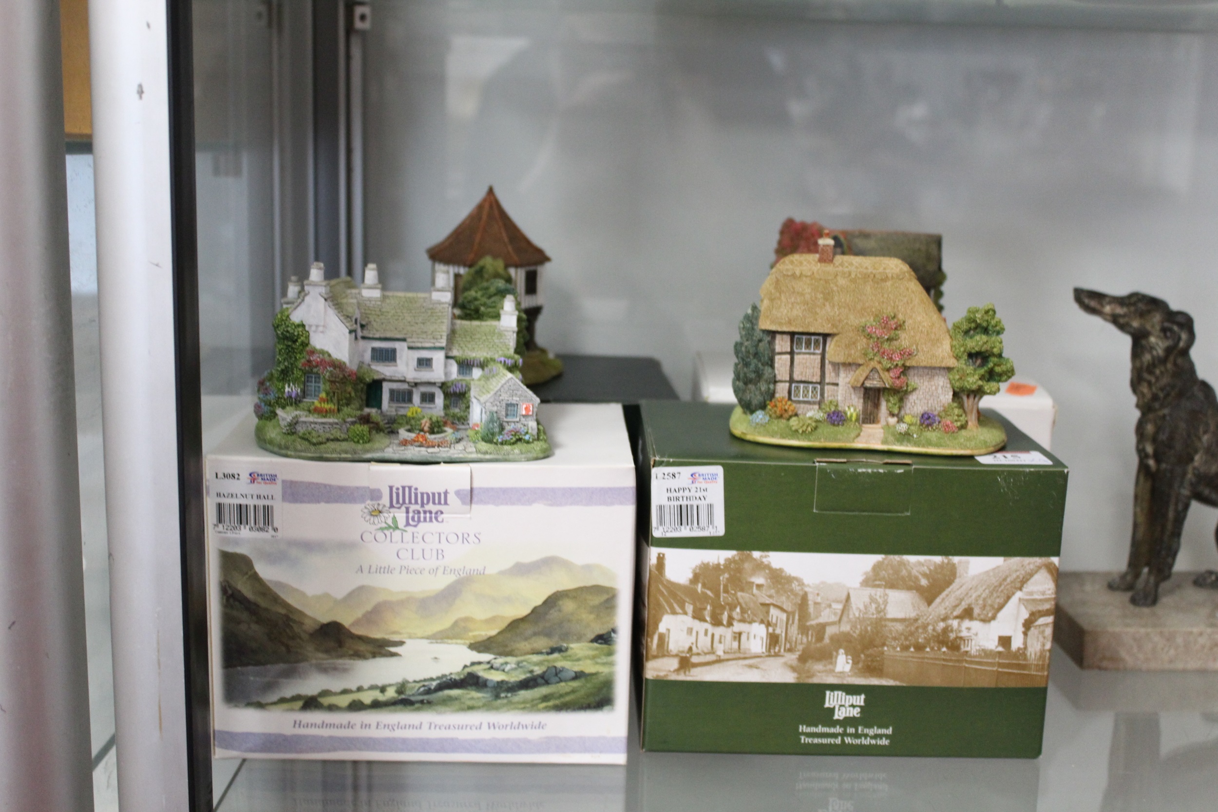 Lot 215 - A collection of four boxed Lilliput Lane