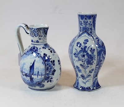 Lot 221 - A Dutch Delft blue and white jug, typically...