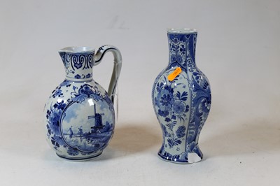 Lot 221 - A Dutch Delft blue and white jug, typically...