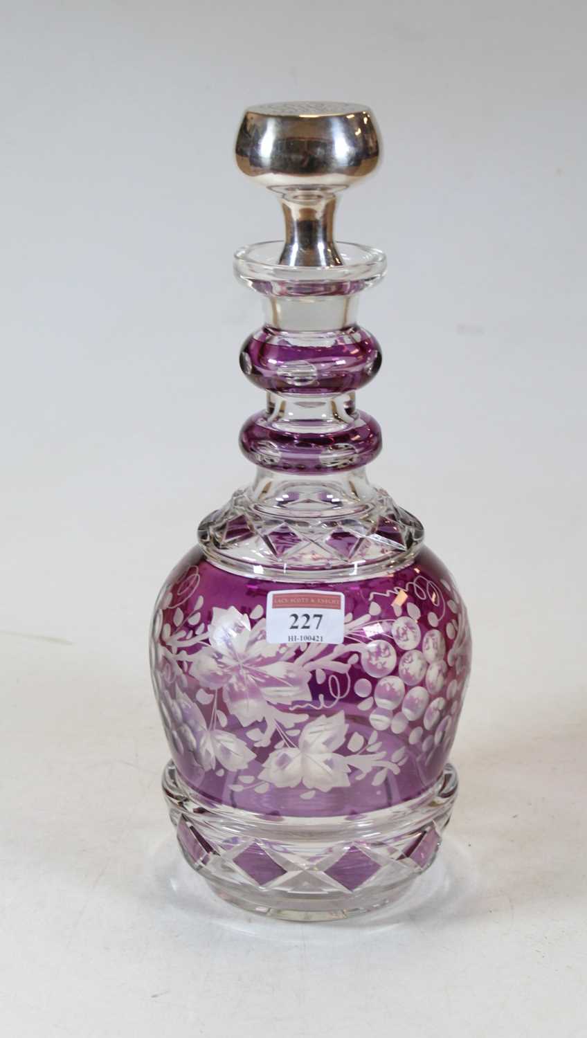 Lot 227 - An amethyst overlaid and etched glass triple...