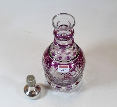 Lot 227 - An amethyst overlaid and etched glass triple...