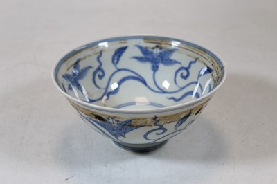 Lot 230 - A Chinese export blue and white rice bowl,...