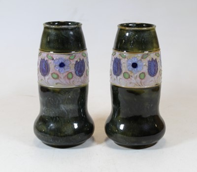 Lot 253 - A pair of Royal Doulton stoneware vases each...