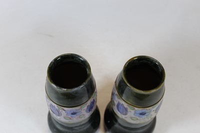 Lot 253 - A pair of Royal Doulton stoneware vases each...