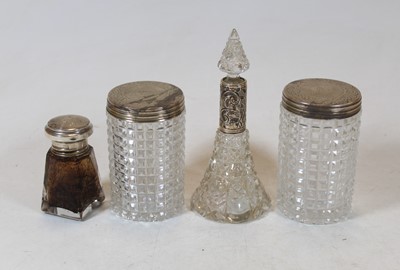 Lot 274 - A pair of cut glass dressing table jars with...