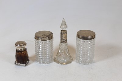 Lot 274 - A pair of cut glass dressing table jars with...