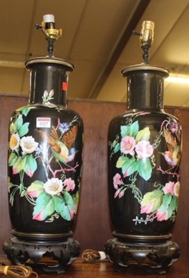 Lot 178 - A pair of floral painted ceramic table lamps,...