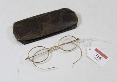 Lot 316 - A pair of early 20th century yellow metal...