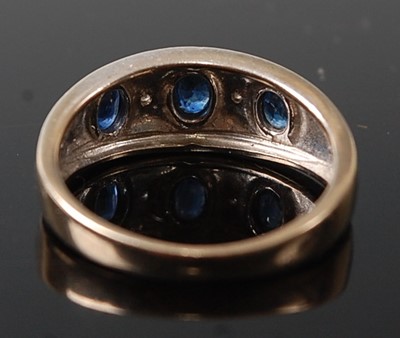 Lot 2612 - A 9ct yellow and white gold, sapphire and...