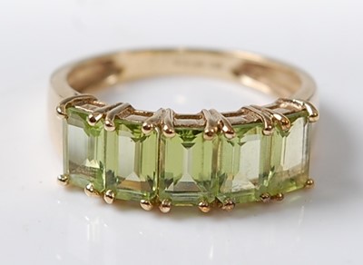 Lot 2619 - A 9ct yellow gold peridot dress ring,...