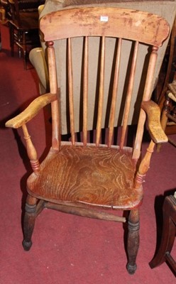 Lot 1418 - An early 20th century elm seat and beech...