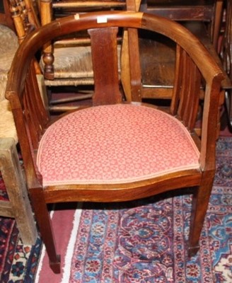 Lot 1423 - An Edwardian mahogany tub elbow chair, with...