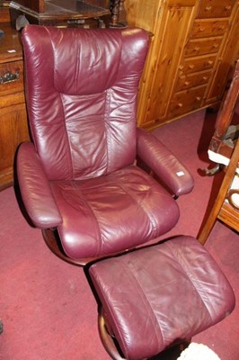 Lot 1433 - A contemporary Stressless burgundy red leather...